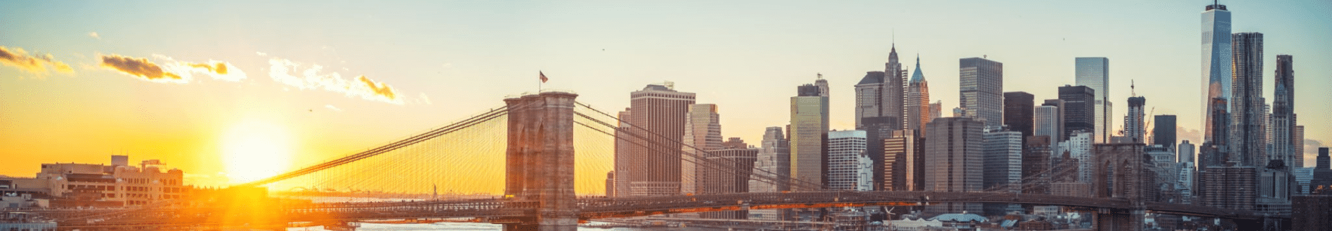 Panoramic view of Brooklyn bridge and Manhattan at sunset, New York City